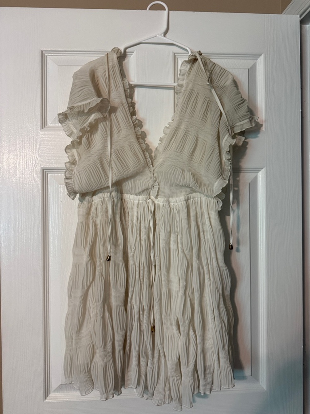 the clothing company Cream Pleated Midi Dress